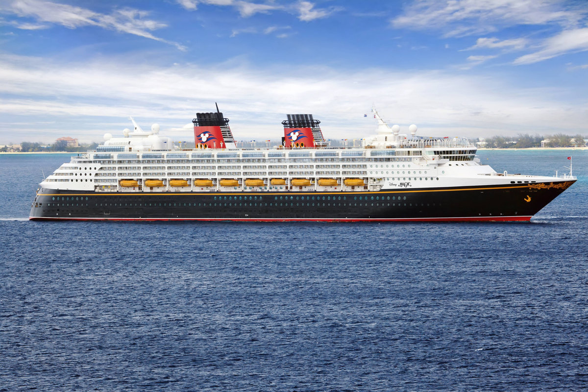 A Disney Cruise Line ship sailing on open blue water